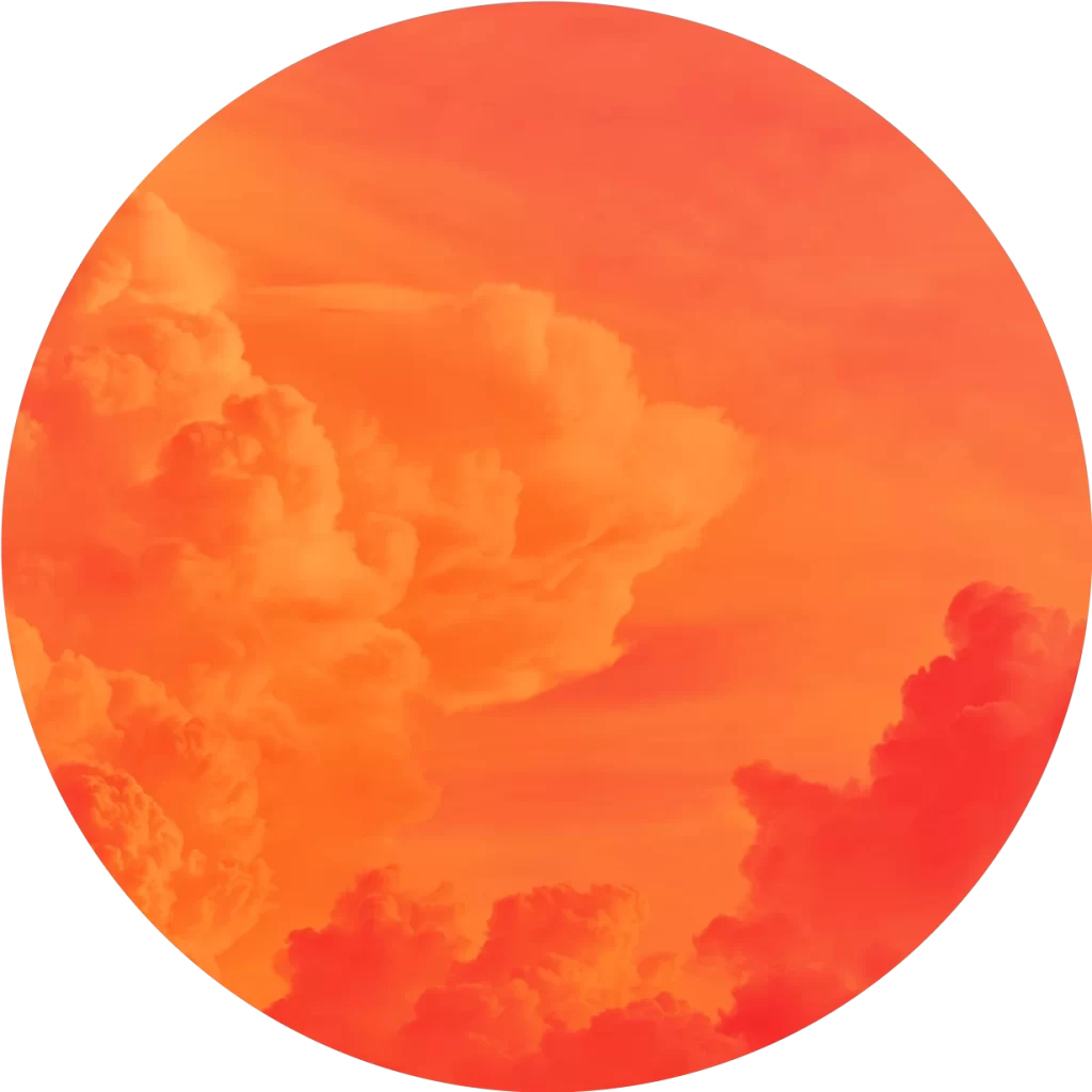 Circular image of clouds in a sky with vivid orange and red hues, creating a dramatic and colorful atmosphere.